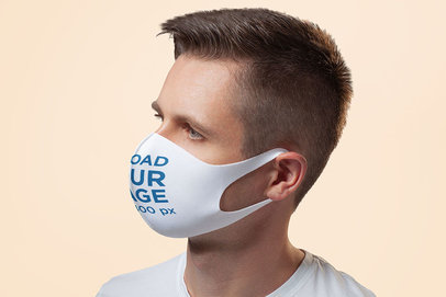 Mockup of the Profile of a Man Wearing a Customizable Face Mask