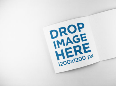 Open Booklet Mockup Lying on a Solid Backdrop