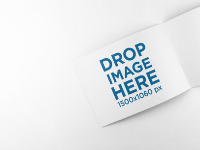 Open Rectangular Booklet Mockup Lying on a Solid Surface