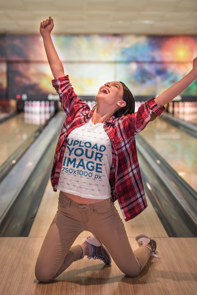 T-Shirt Mockup of a Happy Woman Winning at Bowling