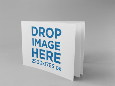 Horizontal Booklet Mockup Standing on a Solid Surface
