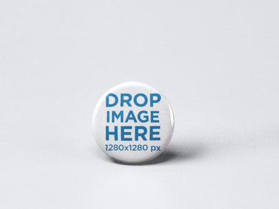 Small Button Mockup Standing on a Solid Surface