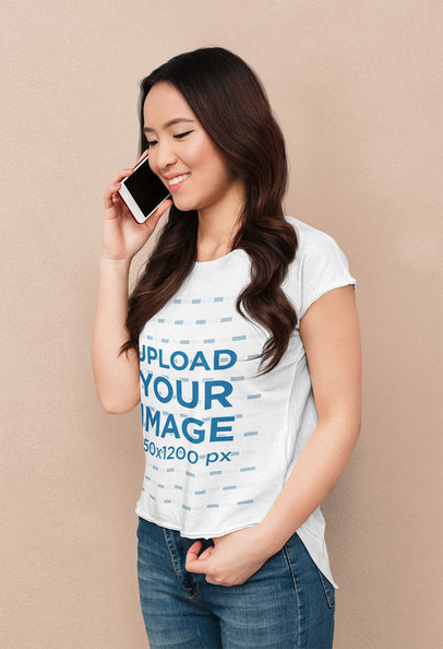 T-Shirt Mockup of a Woman Talking on the Phone While in a Studio