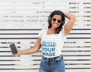 T-Shirt Mockup of a Happy Woman Listening to Her Favorite Song  