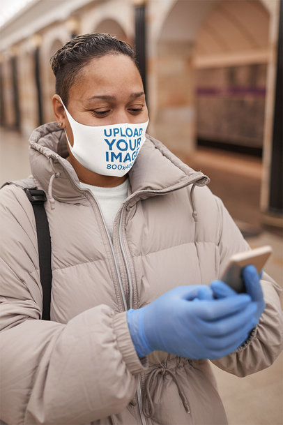 Face Mask Mockup of a Woman Using Her Phone on the Street 46660-r-el2