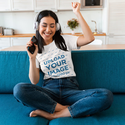 T-Shirt Mockup of a Woman Enjoying Her Music at Home