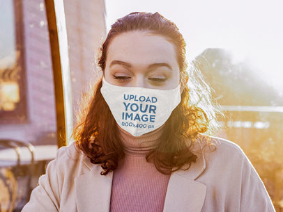 Face Mask Mockup of a Curly-Haired Woman at a Restaurant