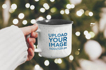 Mockup of a Woman Holding a 12 oz Enamel Mug on Christmas