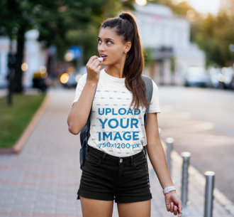 T-Shirt Mockup of a Young Woman Applying Lip Balm 46484-r-el2