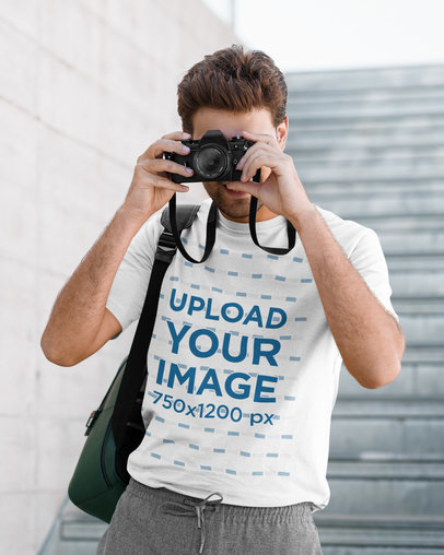 T-Shirt Mockup of a Man Taking a Picture with a Camera
