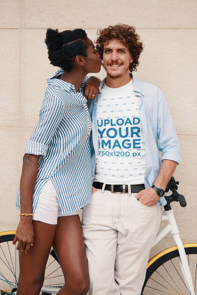 T-Shirt Mockup of a Man Posing with His Girlfriend and His Bike