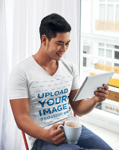 V-Neck Tee Mockup Featuring a Smiling Man Checking His Tablet 46903r-el2