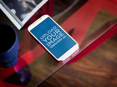 Mockup of a Samsung Galaxy Placed over a Glass Table
