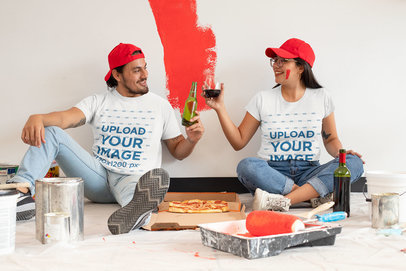 T-Shirt Mockup of a Couple Celebrating While Painting a Room