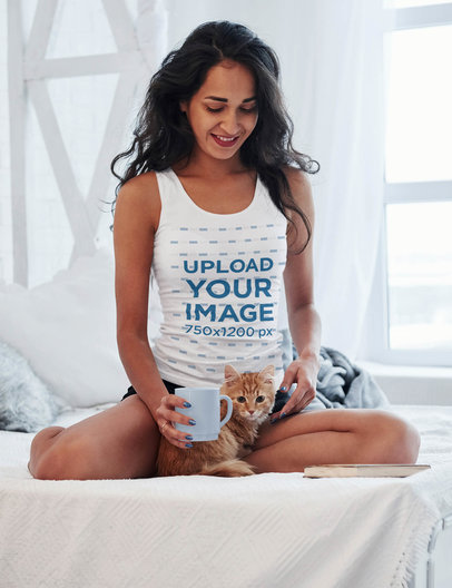 Tank Top Mockup of a Woman Having Coffee in Bed with Her Kitty