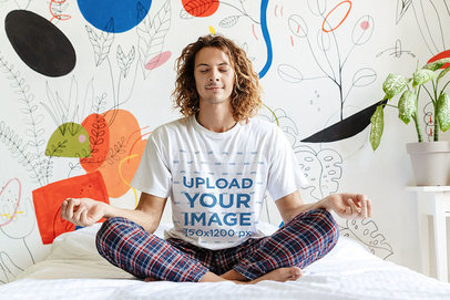 Pajamas Mockup of a Man Wearing a T-Shirt and Doing a Morning Meditation 