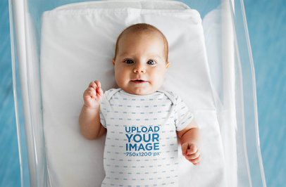 Onesie Mockup of a Baby Lying in a Crib