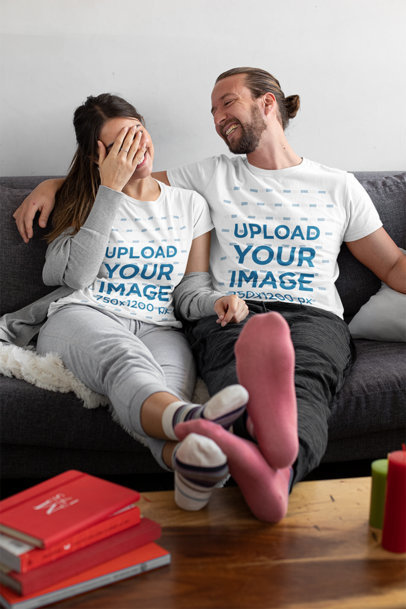 T-Shirt Mockup of a Man Laughing With His Girlfriend at Home 