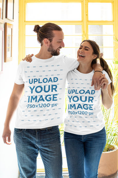 T-Shirt Mockup of a Happy Couple Posing at Home