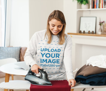 Sweatshirt Mockup of a Young Woman Happily Ironing Her Clothes