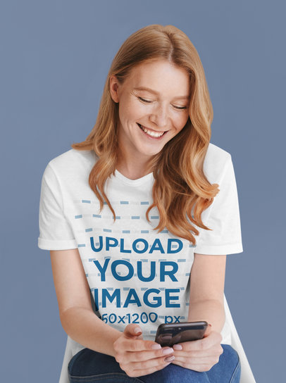 Unisex T-Shirt Mockup of a Woman Reading a Funny Message at a Studio 