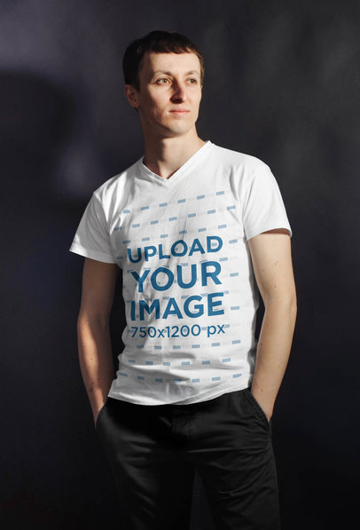 V-Neck T-Shirt Mockup of a Man in a Studio with a Strong Light