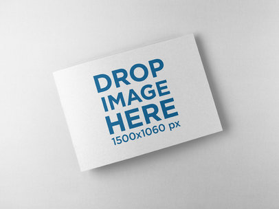 Closed Booklet Mockup Lying on a Solid Color Surface