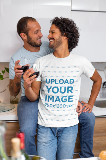 T-Shirt Mockup of a Couple Drinking Wine in Their Kitchen