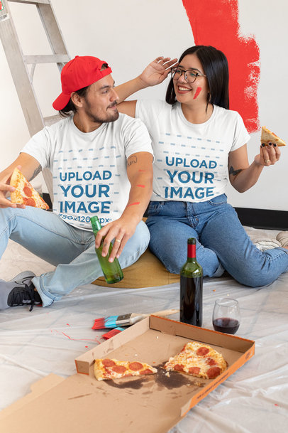 T-Shirt Mockup of a Young Couple Eating Pizza 