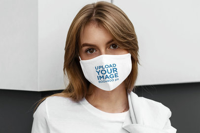 Face Mask Mockup Featuring a Serious Woman Posing