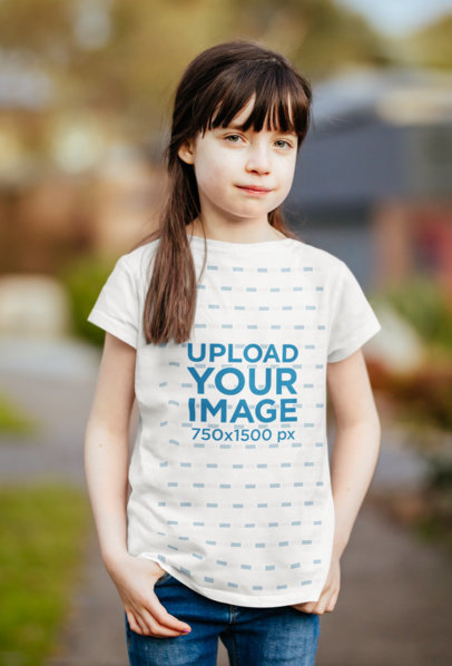 T-Shirt Mockup Featuring a Girl Against a Blurry Background