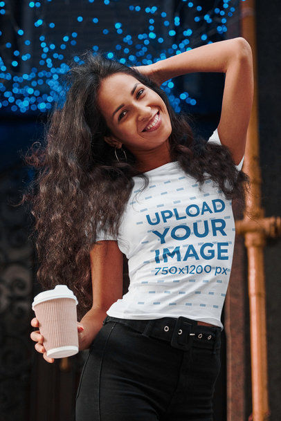 T-Shirt Mockup of a Happy Woman Posing Outside of a Trendy Coffee Shop 44735-r-el2