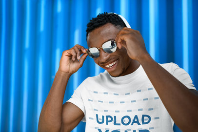Crew Neck T-Shirt Mockup Featuring a Smiling Man with Sunglasses