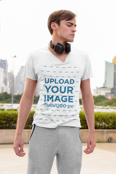 V-Neck Heather T-Shirt Mockup Featuring a Serious Man in the City 
