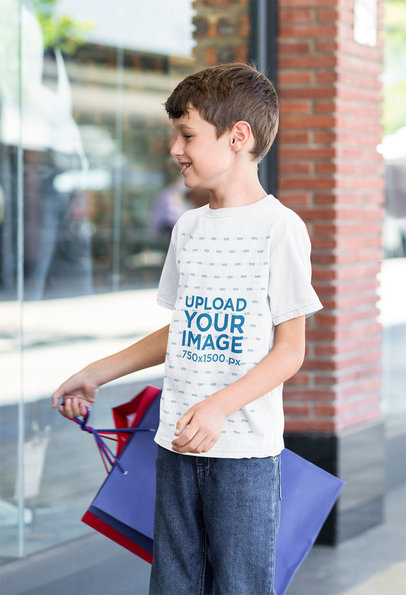 T-Shirt Mockup Featuring a Boy Shopping