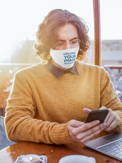 Face Mask Mockup of an Intellectual-Looking Man Using His Smartphone 46692-r-el2
