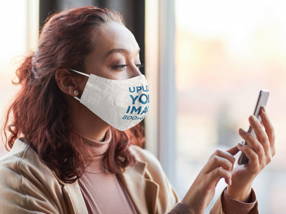 Face Mask Mockup of a Short-Haired Woman Checking Up Her Phone