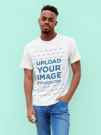 T-Shirt Mockup of a Man Standing Casually at a Studio