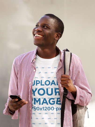 T-Shirt Mockup of a Smiling Man with a Mobile Phone 