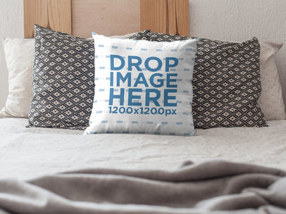 Mockup of a Square Pillow on a Bed with Pillows