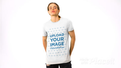 Video of a Man Posing in a T-Shirt Against a White Background