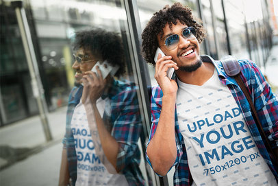 V-Neck T-Shirt Mockup of a Happy Curly-Haired Man on the Phone 