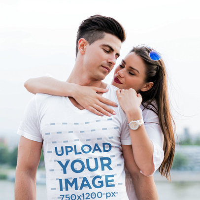 T-Shirt Mockup of a Man Being Hugged by His Girlfriend 