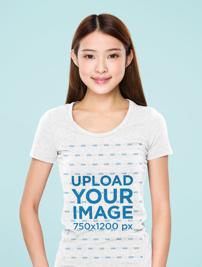 Mockup of a Young Woman Wearing a Heathered T-Shirt at a Studio 