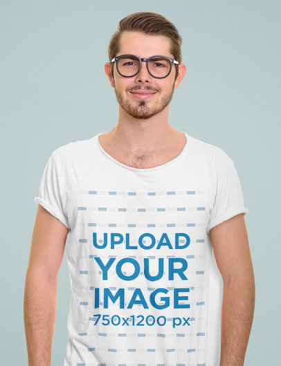 T-Shirt Mockup Featuring a Man with Glasses at a Studio 
