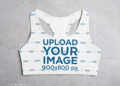 Mockup of a Flat Sports Bra on a Grey Surface