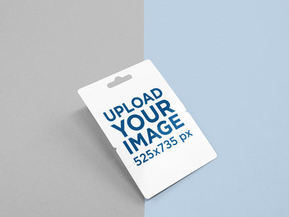 Angled Gift Card Mockup Floating Over a Bicolor Surface
