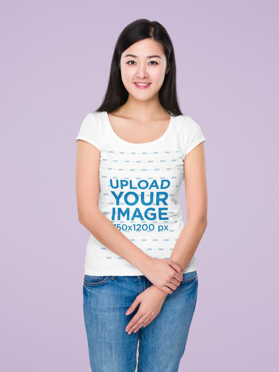 T-Shirt Mockup of a Young Woman Against a Customizable Surface