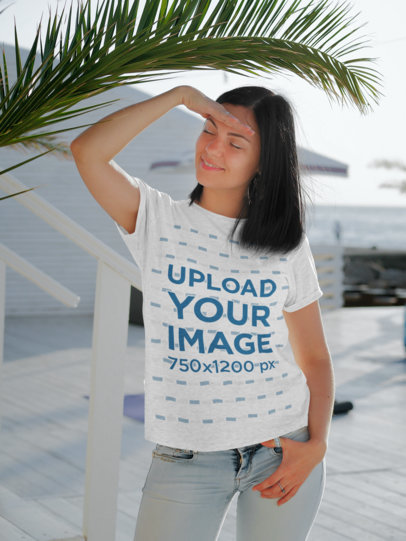 T-Shirt Mockup of a Woman Posing at a Pier 