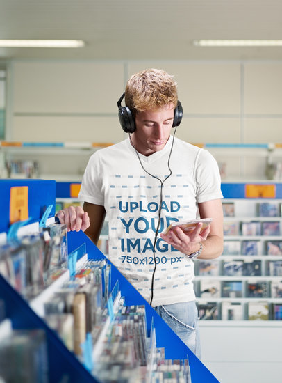 T-Shirt Mockup Featuring a Man Listening to Music at a Record Store 39536-r-el2